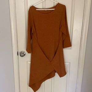 Pumpkin color asymmetrical dress by Bryn Walker.